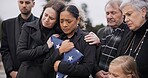 Sad, family and funeral with comfort, woman and support with compassion, empathy and depression. People, wife of loved one and friends with love, USA flag and sympathy with grief, goodbye or remember