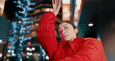 Buy stock photo Japanese, woman and portrait with dancing outdoor at night in streetwear, trendy outfit or fashion. Dancer, person and contemporary style with arm movement, performance and entertainment in the city