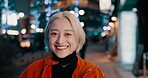 Portrait, happy woman and night in Japanese city of Tokyo with freedom on travel, adventure or journey. Gen z, girl or excited to explore urban town street on vacation or holiday with neon lights