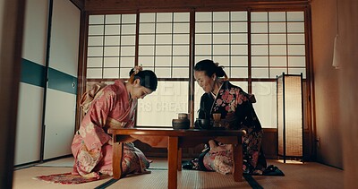 Buy stock photo Traditional, home and Japanese women with tea for culture with leaves and herbs in tearoom. Friends, ceremony and people with herbal beverage for wellness, mindfulness and detox for drinking ritual