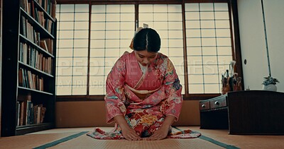 Woman, prayer and Japanese or spiritual respect in tatami room for tradition culture, gratitude or ritual. Asian person, kneel and kimono practice or mindfulness healing or god worship, holy or zen