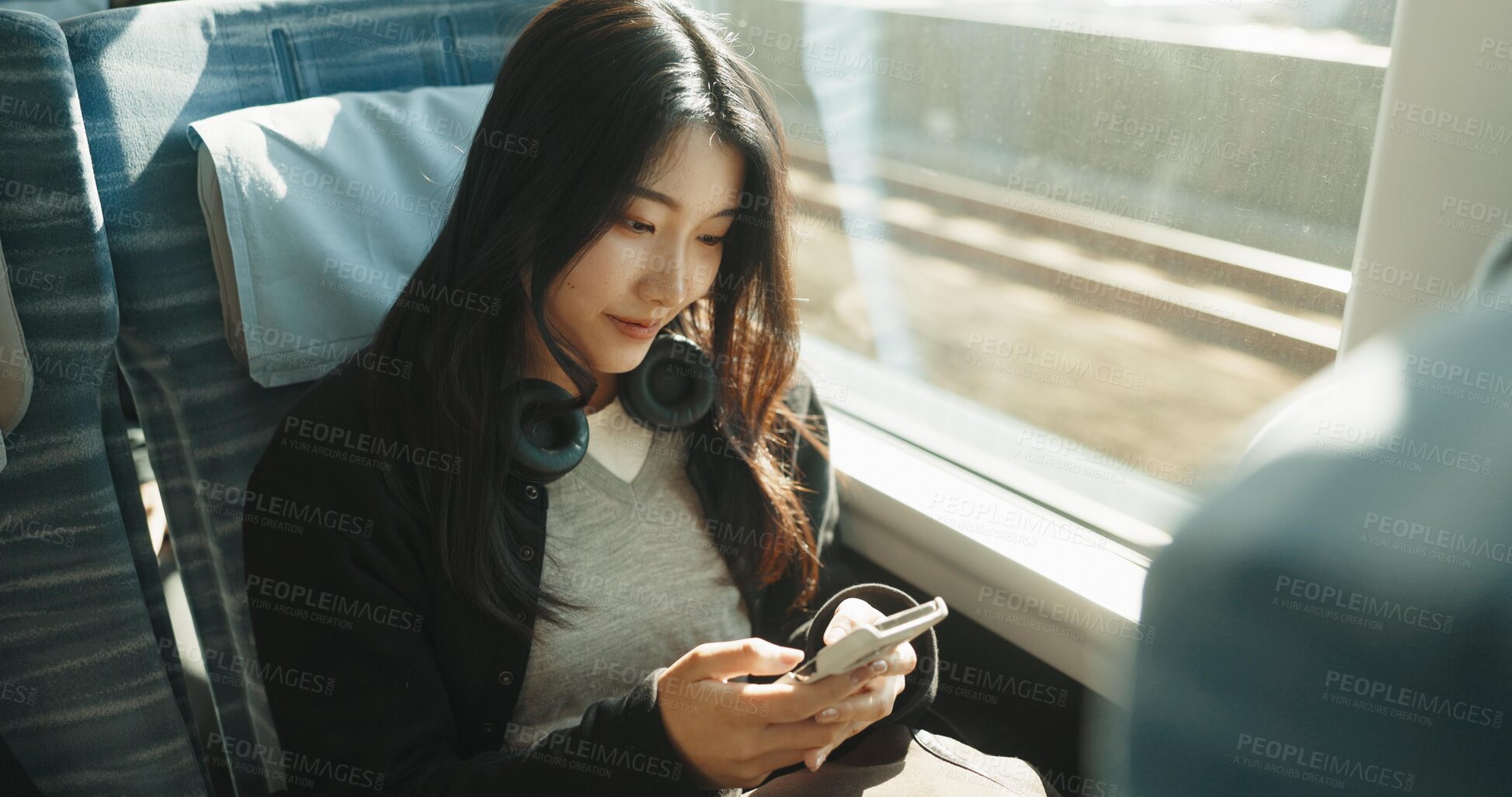 Buy stock photo Japan woman, travel and train on smartphone, social media and public transportation on metro bullet. Person, cellphone and online on fast vehicle for weekend trip and commute in tokyo for adventure