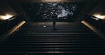 Japanese woman, kimono and walking on stairs at night, city and religion in heritage celebration. Young person, culture or traditional clothes in tokyo in beauty, steps or pride in indigenous fashion