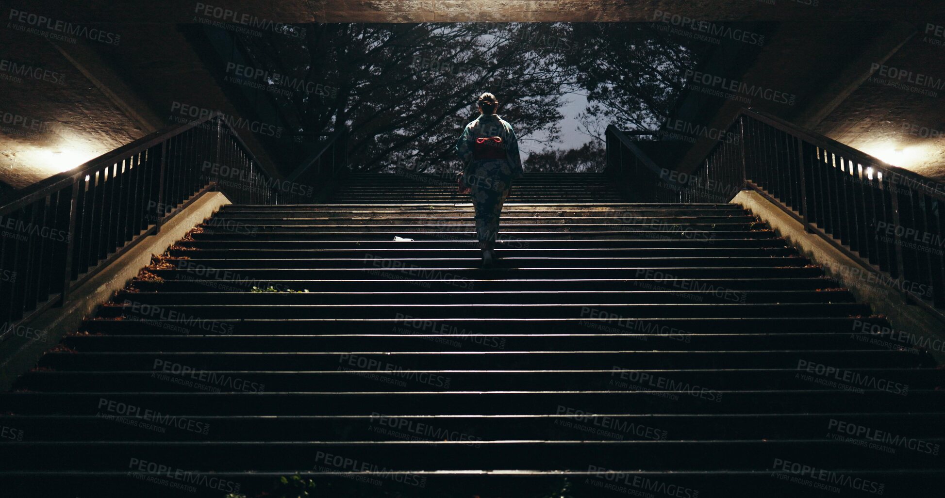 Buy stock photo Japanese woman, kimono and walking on stairs at night, city and light in heritage on journey. Young person, culture and traditional clothes in tokyo in respect, steps and pride in indigenous fashion