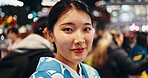 Japanese woman, portrait and night in city, busy urban street or crowd on commute, walk and outdoor. Girl, person and happy for vacation, exploring or journey on metro sidewalk for adventure in Tokyo
