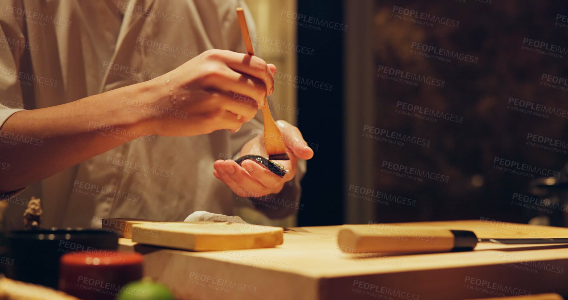 Buy stock photo Hands, food and chef cooking sushi in restaurant for traditional Japanese cuisine or dish closeup. Kitchen, table for seafood preparation and person working with gourmet meal recipe ingredients