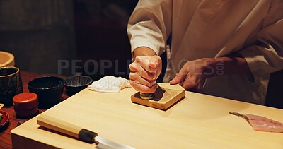 Buy stock photo Hands, food and wasabi with sushi chef in restaurant for traditional Japanese cuisine or dish closeup. Kitchen, seafood ingredients and preparation and person working with gourmet meal recipe