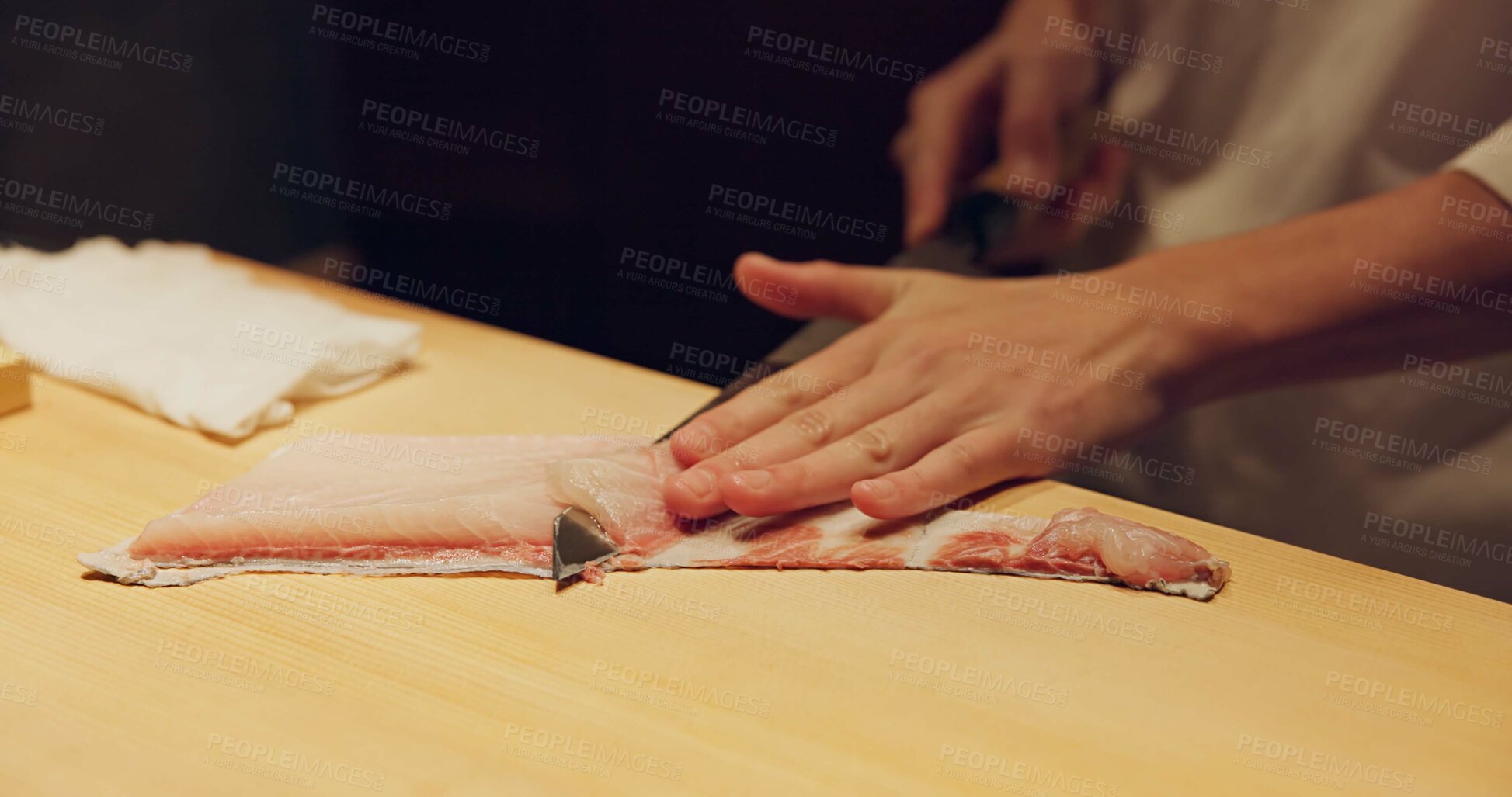 Buy stock photo Hands, food and sushi chef cutting fish in restaurant for traditional Japanese cuisine or dish closeup. Kitchen, raw seafood preparation and person working with gourmet meal recipe ingredients