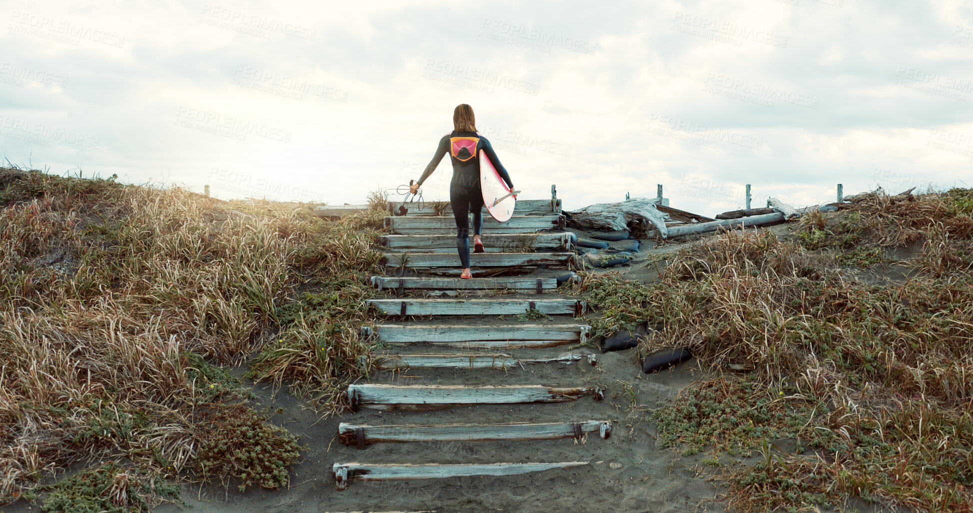 Buy stock photo Woman on stairs at beach, surfer and surfboard with back view and nature, extreme sports for fitness. Athlete walk on steps, exercise and surfing, workout or training for health and wellness outdoor