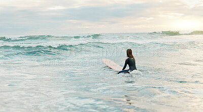 Buy stock photo Surfing, beach and woman on surfboard in ocean for water sports, fitness and freedom in morning. Nature, travel and person on tropical holiday, vacation and adventure by sea for fun, hobby and relax