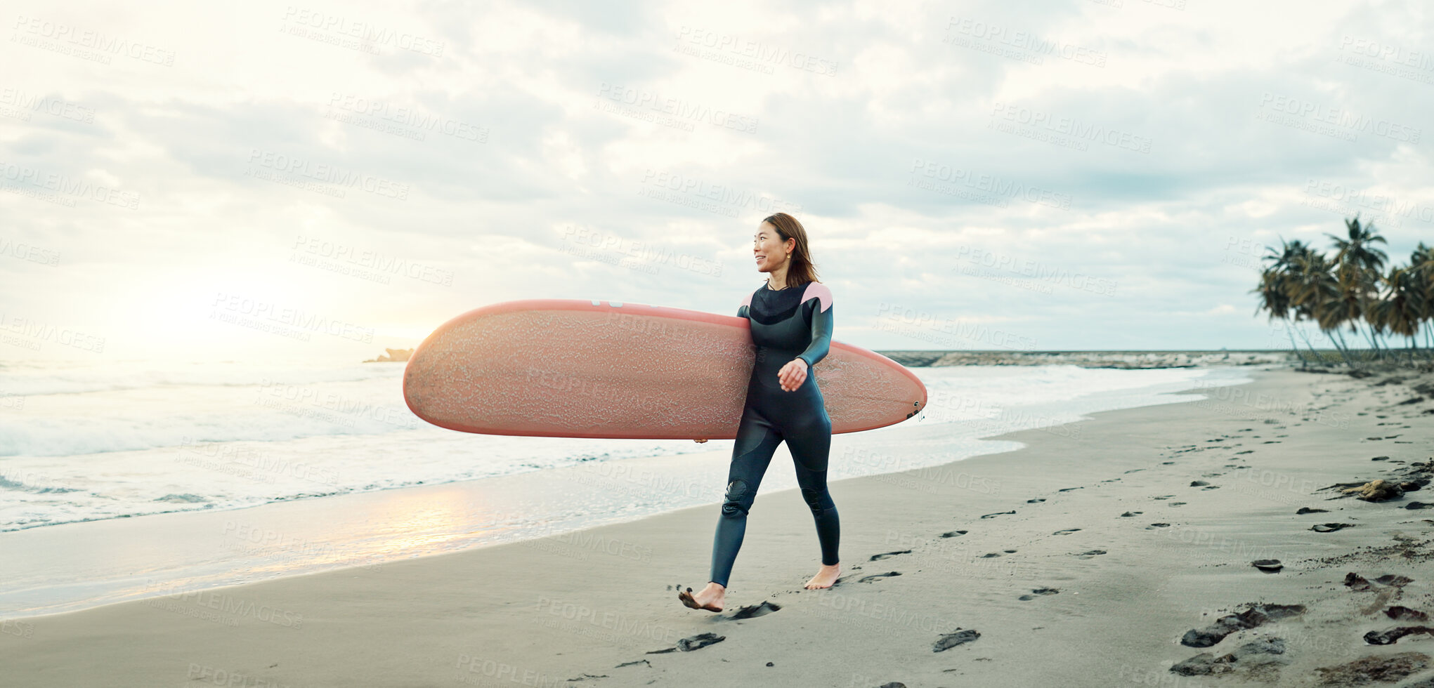 Buy stock photo Woman, surfing board and walking on sand at beach, sea and ocean for summer holiday, travel adventure and happiness. Japanese surfer on shore for water sports, freedom and relax for tropical vacation