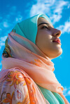 Muslim, portrait and woman wearing a traditional scarf or hijab for beauty fashion, modesty, and Islam. Confident, vibrant and beautiful shot of girl with colorful textile for awareness and hope