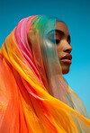 Muslim, portrait and woman wearing a traditional scarf or hijab for beauty fashion, modesty, and Islam. Confident, vibrant and beautiful shot of girl with colorful textile for awareness and hope