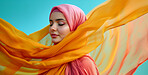 Muslim, portrait and woman wearing a traditional scarf or hijab for beauty fashion, modesty, and Islam. Confident, vibrant and beautiful shot of girl with colorful textile for awareness and hope