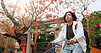 Bicycle, travel and man riding by building for exercise or transportation to college academy. Fitness, backpack and young male student driving a bike to university for carbon footprint by houses.