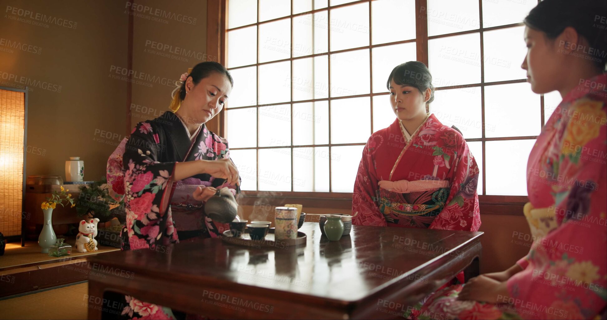 Buy stock photo Japanese, women and matcha for tea ceremony in Chashitsu with kimono dress and traditional custom. People, temae and vintage style outfit for culture, fashion and honor with antique crockery 