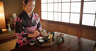 Buy stock photo Japanese, woman and kimono for tea ceremony in Chashitsu room with matcha and traditional custom. Person, temae and vintage style outfit or dress for culture, fashion and honor with antique crockery 