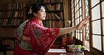 Open window, Japanese and woman with architecture, apartment and morning with culture. Library, calm and zen with sliding door, female person and traditional dress wit accommodation in Tokyo