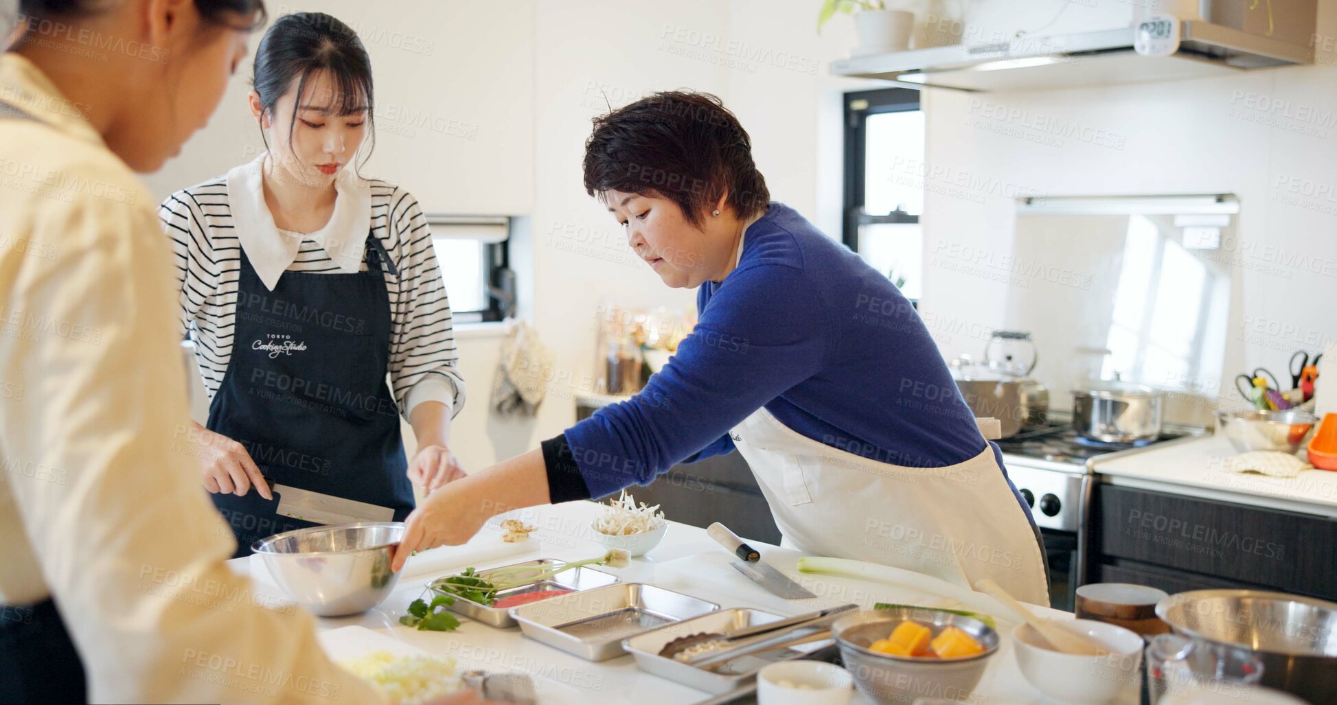 Buy stock photo Japanese chef, women and cooking school with teaching, advice and knife for vegetables, ingredients or food. People, cuisine and fine dining in kitchen with coaching, support and knowledge in Tokyo