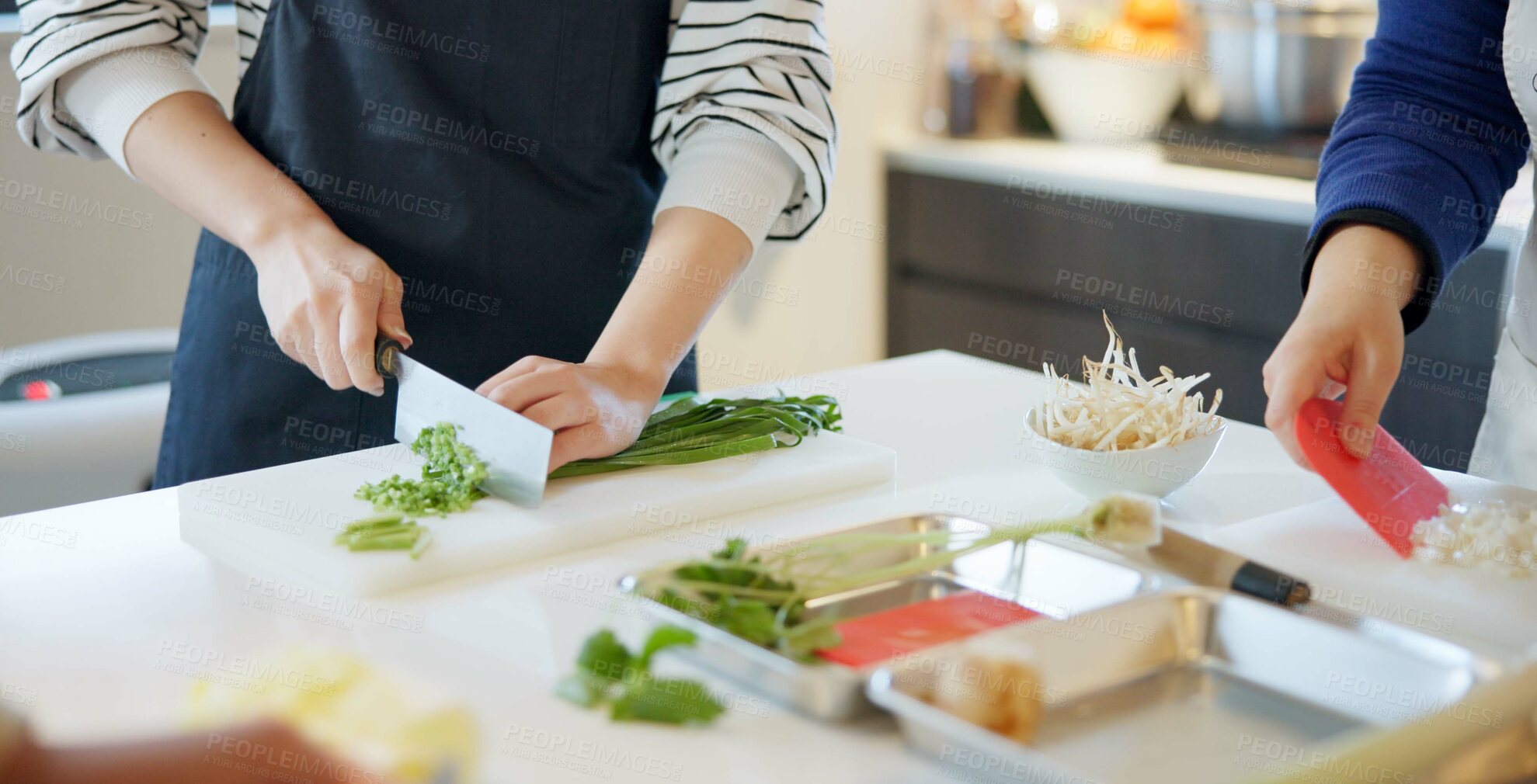 Buy stock photo Chef hands, knife and spring onion for cooking, chopping and prepare ingredients for catering services. Person, cutting vegetables and food for diet, nutrition and fine dining at restaurant in Tokyo