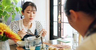 Buy stock photo Japanese woman, eating and food in restaurant, chopsticks and hungry with plate for nutrition. Girl, people and bowl for health, wellness and diet with choice at cafeteria, diner and brunch in Tokyo