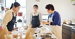 Japan, chef and cooking in kitchen with teaching for recipe, Japanese cuisine and healthy meal in restaurant. People, women and traditional lunch with learning or instruction for dinner and culture