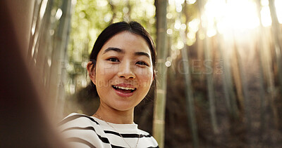 Buy stock photo Japanese woman, selfie and bamboo forest for portrait with smile, pride and bush for post on web blog. Girl, person and happy influencer on adventure, trekking and hiking by trees for social network