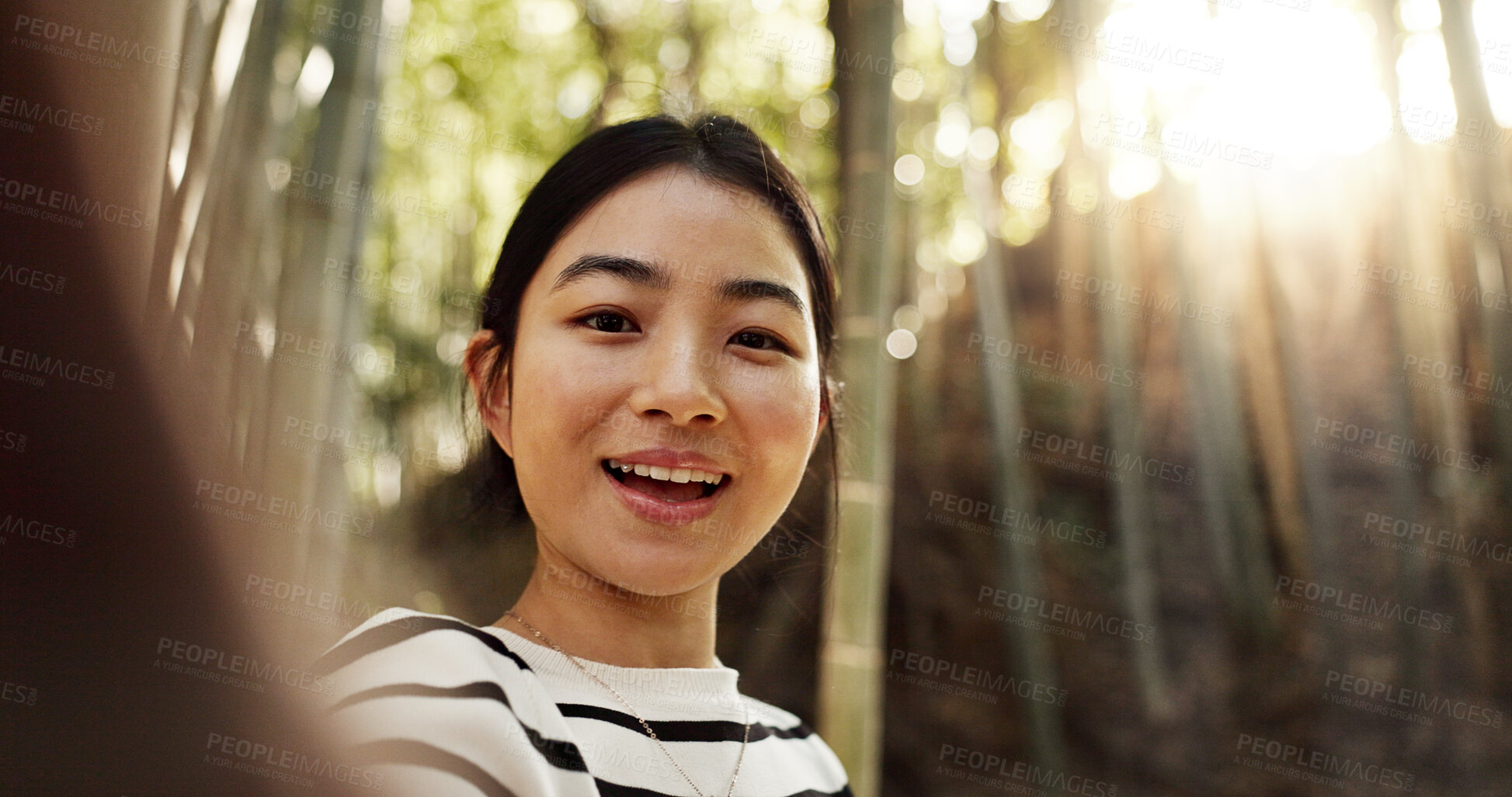 Buy stock photo Japanese woman, selfie and bamboo forest for portrait with smile, pride and bush for post on web blog. Girl, person and happy influencer on adventure, trekking and hiking by trees for social network