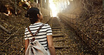 Nature, travel and  back of Japanese woman in park for adventure on holiday, vacation and morning in woods. Relax, happy and person in forest, path and trail to explore, walking and freedom in Kyoto