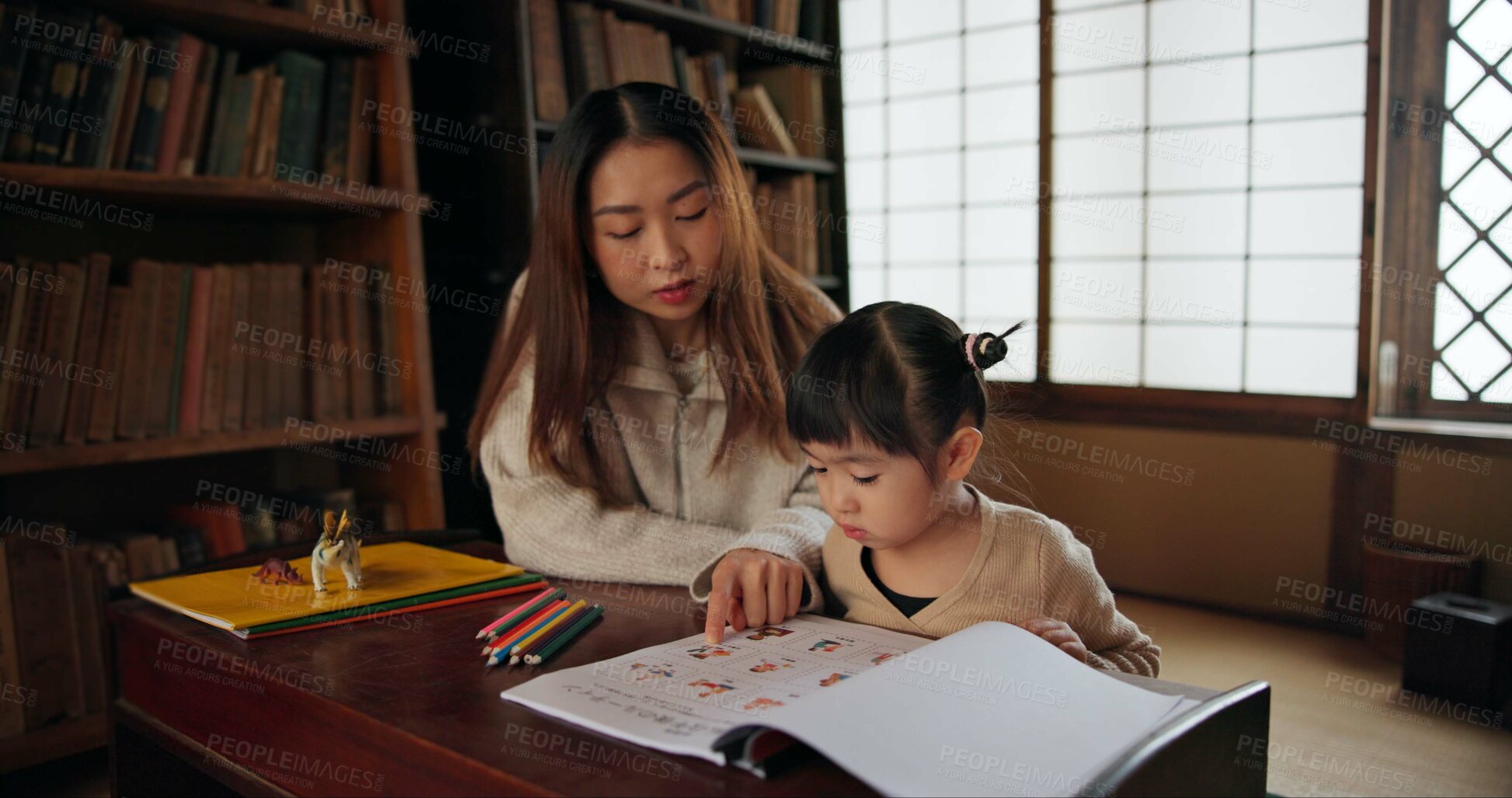 Buy stock photo Child, mother and teaching education in home for drawing in Japanese or tutor schooling, development or book. Female person, girl daughter and pencils in Tokyo or writing lesson, studying or creative