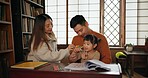 Man, woman and teaching child or books in Japanese for education, learning or development. Family, daughter and pencils at desk in Tokyo for creative art drawing or bonding, kindergarten or writing