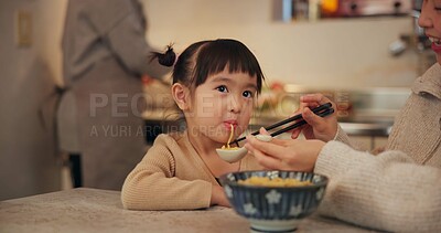 Buy stock photo Family, japanese and woman feeding daughter in kitchen of home for growth, health or nutrition. Food, girl eating in Tokyo apartment with mother and grandparent for diet or child development