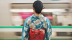 Woman, japan and train station, kimono and travel with public transport, metro bullet in city. Person, journey or traditional clothes in motion blur on weekend or commute in tokyo on adventure