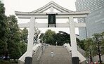 Back, shrine and steps with Japanese woman walking in city temple for belief, faith or religion. Building, worship and location with person on stairs in Tokyo for tradition, mindfulness or adventure