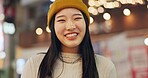 Woman, Japanese and portrait in street at night for Tokyo travel destination, journey or happy. Female person, face and smile or road city light bokeh for holiday adventurer, vacation or downtown