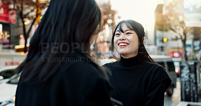 Buy stock photo Happy, women and friends in a street, conversation and chatting with fun, vacation and reunion. People, Japan and girls with joy, discussion and cheerful in the road, urban town and communication