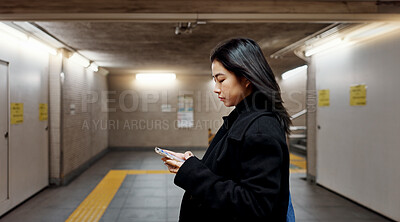 Buy stock photo Phone, subway and Japanese woman on internet, social media and walking to travel in Tokyo. Smartphone, scroll and serious person on app, reading email and information on mobile website on commute