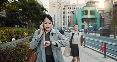 Buy stock photo Phone call, watch and Japanese businesswoman in city, late for work on Tokyo street or sidewalk. Stress, time and schedule with young professional employee walking on road in rush for appointment