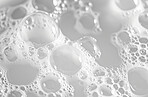 Abstract, bubble and foam background for cleaning detergent, laundry business and hygiene care backdrop. White, surface and shiny soap closeup of hair shampoo, cosmetics or cleaning detergent