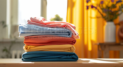 Clothing, clean and folded laundry for laundromat business service, background or cleaning detergent backdrop. Colourful, neat and pile of shirts for mockup, wardrobe and eco friendly product