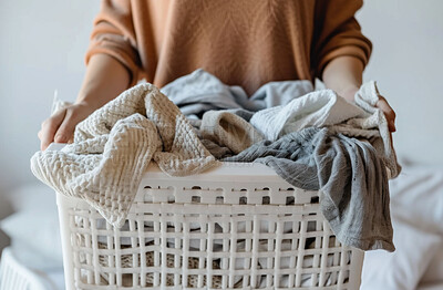 Buy stock photo Cropped woman, clean laundry and clothes in a washing basket at laundromat, home and self service. Fresh, hygienic and closeup of pile of clothing for textile, fabric softener and cleaning duties