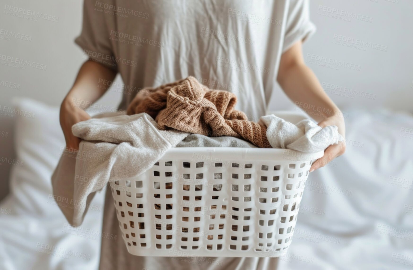 Buy stock photo Cropped woman, clean laundry and clothes in a washing basket at laundromat, home and self service. Fresh, hygienic and closeup of pile of clothing for textile, fabric softener and cleaning duties