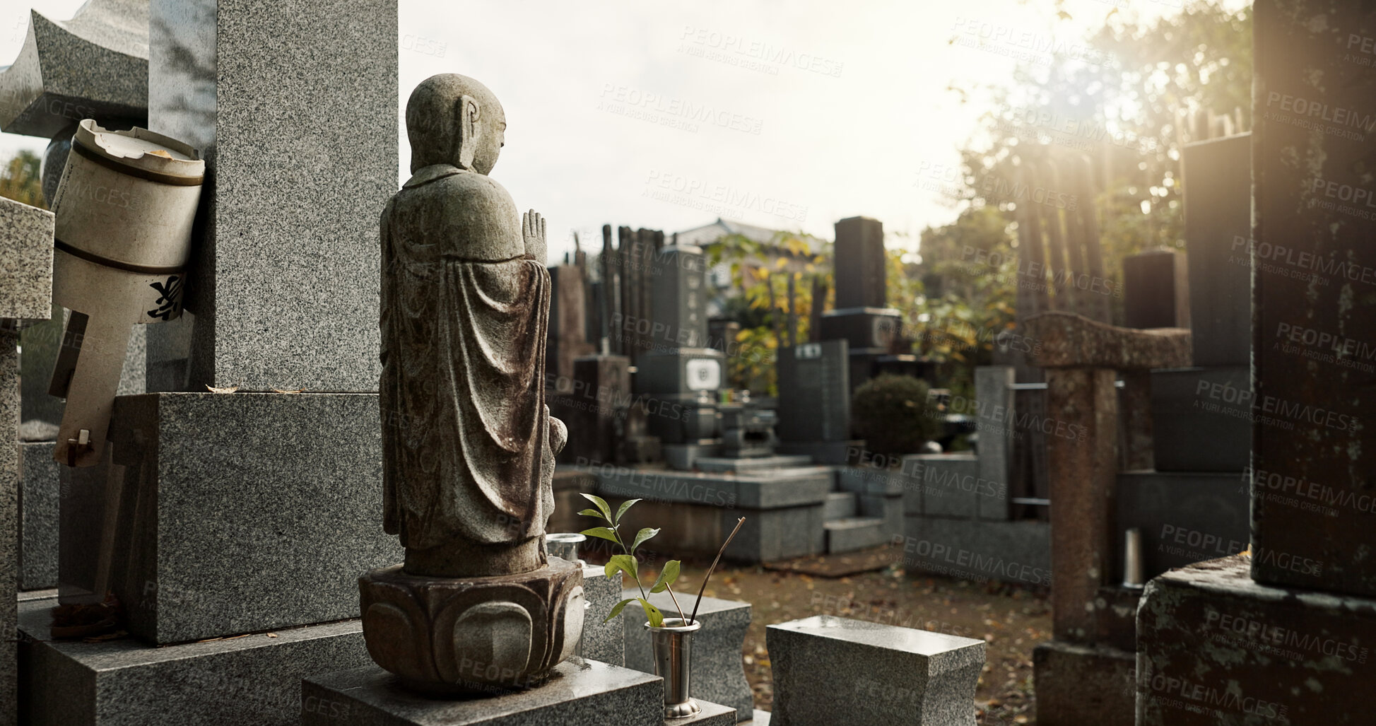 Buy stock photo Japan, prayer hands and buddhist statue at graveyard for spiritual religion in Tokyo. Jizo sculpture, cemetery or gravestone for memorial service, culture and traditional tombstone for worship or zen