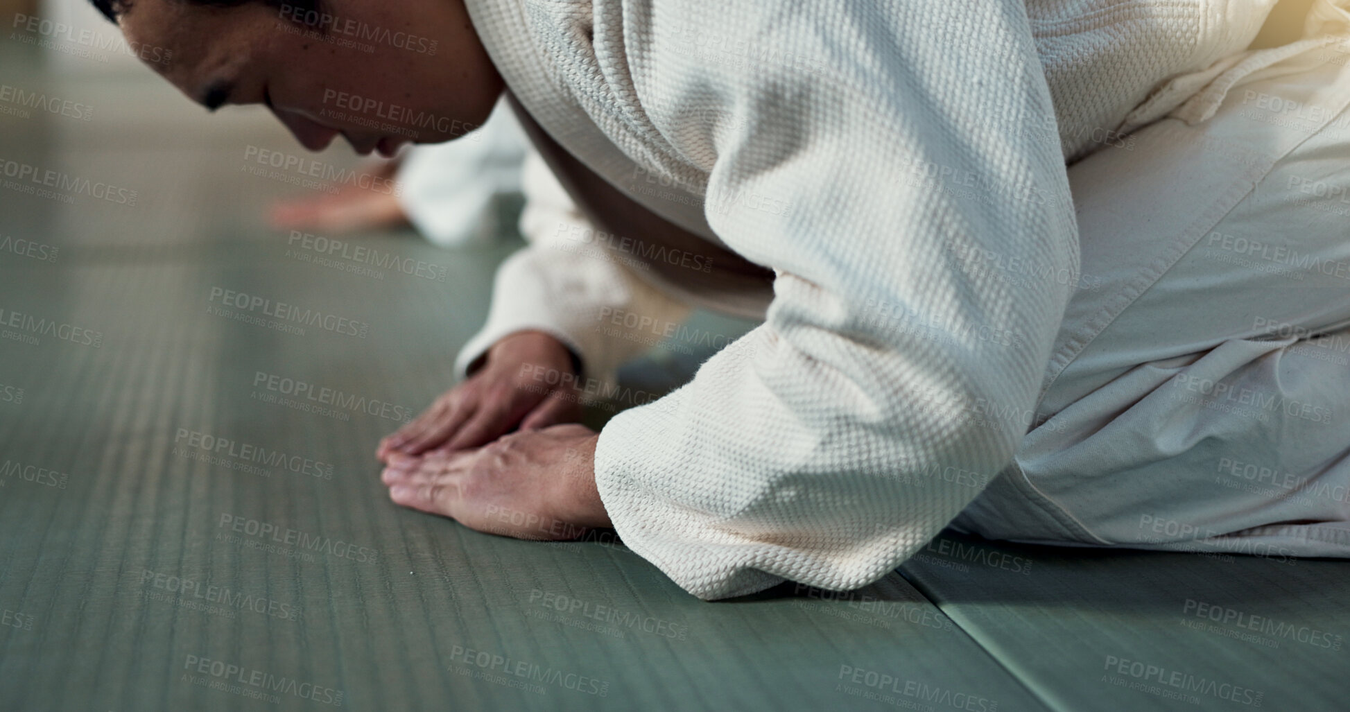 Buy stock photo Asian man, student or bow in dojo for respect, greeting or honor to master at indoor gym. Closeup of male person or karate trainer bowing for etiquette, attitude or commitment in martial arts class