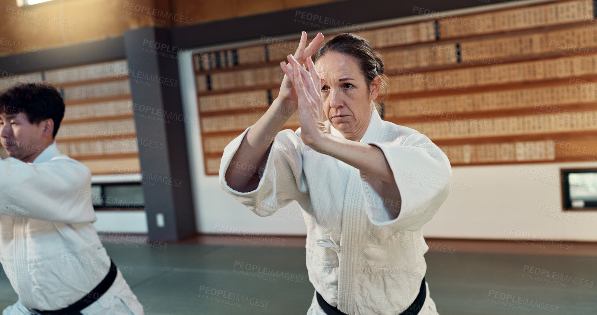Buy stock photo Students learning aikido, fitness and martial arts training class for self defense and discipline. Combat, fight and education, black belt with Japanese people and workout for exercise in dojo