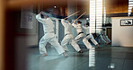 Aikido, dojo class and people training for self defense, combat and Japanese group practice sword technique. Black belt students, transparent window and learning martial arts for safety protection