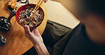 Closeup of bowl of noodles, hands and person is eating food, nutrition and sushi with chopsticks in Japan. Hungry for Japanese cuisine, soup and Asian culture, traditional meal for lunch or dinner