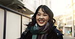 Happy, laughing and face of Asian woman in the city on vacation, adventure or weekend trip. Smile, travel and portrait of excited young female person with positive attitude in urban town on holiday.