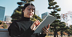 Happy asian woman, tablet and research at park in city for social media or outdoor networking. Female person smile with technology in relax for online search, reading or communication in nature