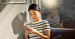 Asian woman, train and travel with smartphone and communication, commute or adventure with transport. Email, chat and scroll social media with tourism in Japan, public transportation and mobile app